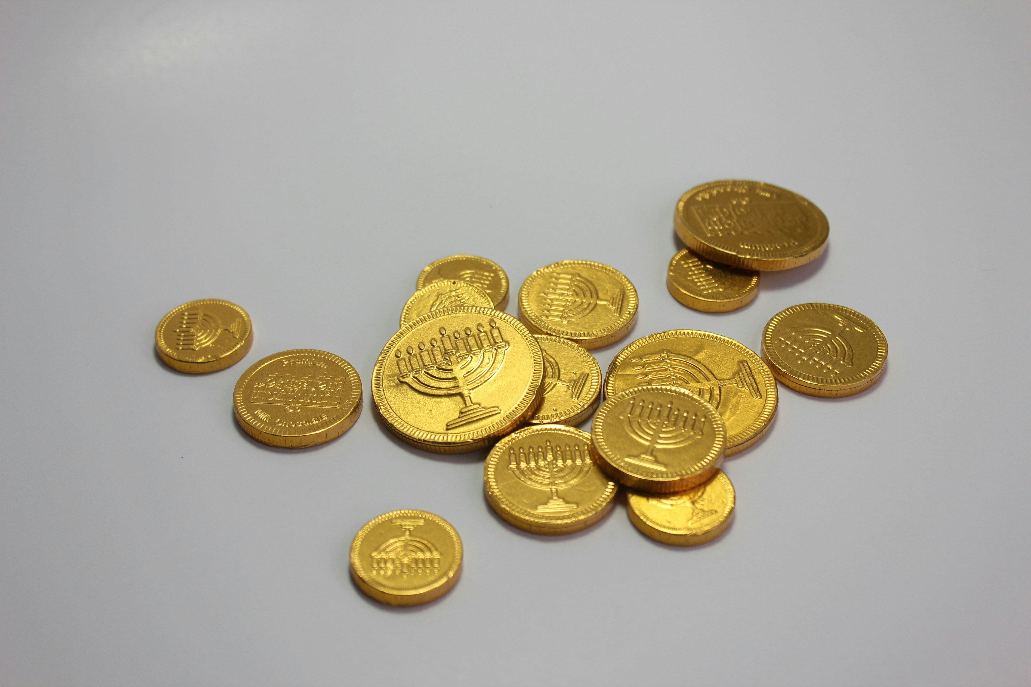 Festive Chanukah Gelt Chocolate Coins On White Background To Celebrate The Holiday Season
